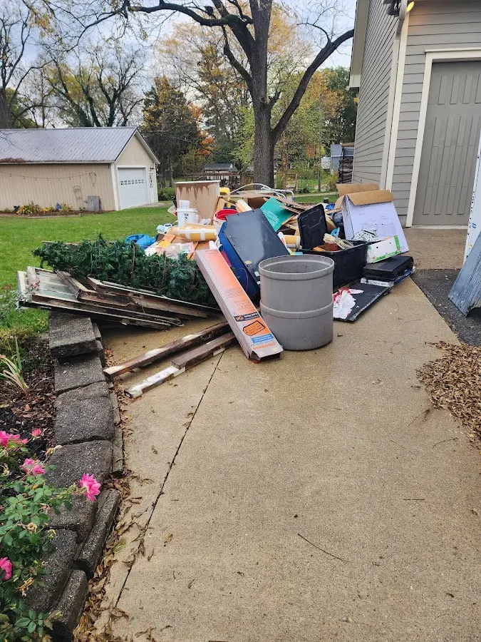 Dumpster being loaded with debris for 3 Yard Dumpster Rental in Brookfield
